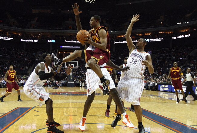 CHARLOTTE, NC - DECEMBER 29:  Ramon Sessions #3 of the Cleveland Cavaliers looks to pass as he kicks Gerald Wallce #3 of the Charlotte Bobcats in the face during their game at Time Warner Cable Arena on December 29, 2010 in Charlotte, North Carolina. NOTE TO USER: User expressly acknowledges and agrees that, by downloading and/or using this Photograph, User is consenting to the terms and conditions of the Getty Images License Agreement.  (Photo by Streeter Lecka/Getty Images)