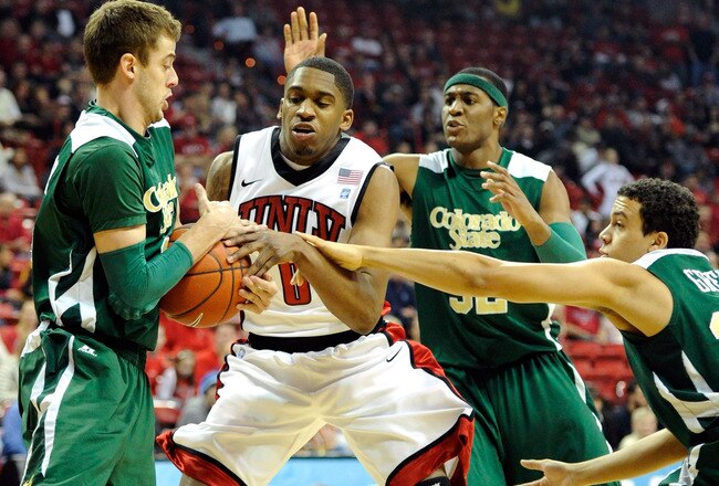 LAS VEGAS, NV - JANUARY 19:  Oscar Bellfield #0 of the UNLV Rebels loses the ball as (L-R) Wes Eikmeier #2, Andy Ogide #32 and Dorian Green #22 of the Colorado State Rams defend during their game at the Thomas & Mack Center January 19, 2011 in Las Vegas, Nevada.  (Photo by Ethan Miller/Getty Images)