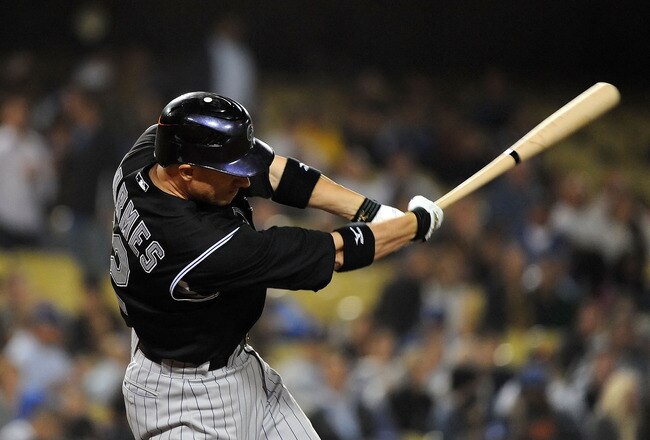 LOS ANGELES, CA - SEPTEMBER 17:  Clint Barmes #12 of the Colorado Rockies hits a single in the eighth inning against the Los Angeles Dodgers at Dodger Stadium on September 17, 2010 in Los Angeles, California.  (Photo by Lisa Blumenfeld/Getty Images)