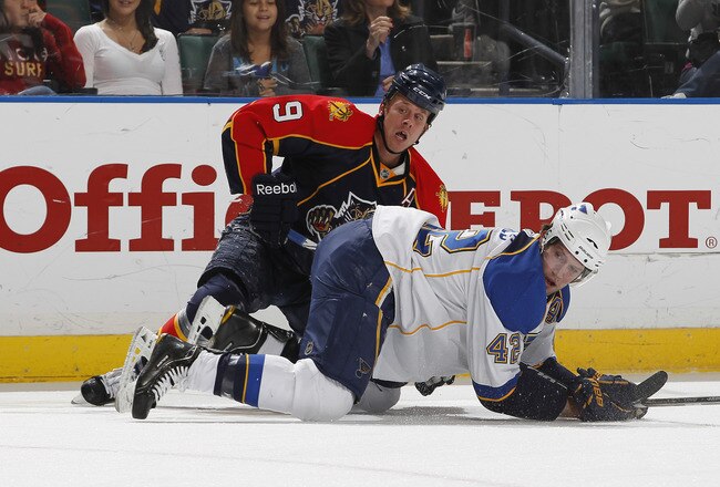 SUNRISE, FL - FEBRUARY 8: Stephen Weiss #9 of the Florida Panthers and David Backes #42 of the St Louis Blues go to the ice after a check on February 8, 2011 at the BankAtlantic Center in Sunrise, Florida. (Photo by Joel Auerbach/Getty Images)