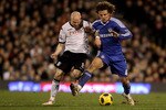 LONDON, ENGLAND - FEBRUARY 14:  David Luiz of Chelsea fights for the ball with Andrew Johnson of Fulham during the Barclays Premier League match between Fulham and Chelsea at Craven Cottage on February 14, 2011 in London, England.  (Photo by Scott Heavey/Getty Images)