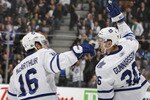 TORONTO, CANADA - JANUARY 20: Clarke MacArthur #16 and Carl Gunnarsson #36 of the Toronto Maple Leafs celebrate Carl Gunnarsson goal against the Anaheim Ducks during game action at the Air Canada Centre January 20, 2011 in Toronto, Ontario, Canada. (Photo by Abelimages/Getty Images)