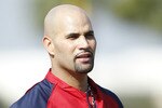 JUPITER, FL - FEBRUARY 17: Albert Pujols #5 of the St. Louis Cardinals  takes a rest during fielding practice at Roger Dean Stadium on February 17, 2011 in Jupiter, Florida. (Photo by Joel Auerbach/Getty Images)