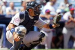 NEW YORK - JULY 13:  Jesus Montero of the New York Yankees and playing for World Futures Team catches against the United States Olympic Team during the 2008 XM All-Star Futures Game at Yankee Stadium on July 13, 2008 in the Bronx borough of New York City.  (Photo by Jim McIsaac/Getty Images)