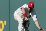 ST. LOUIS, MO - APRIL 10:   Jim Edmonds #15 of the St. Louis Cardinals makes a diving catch against the Milwaukee Brewers at Busch Stadium on April 10, 2006 in St. Louis, Missouri.  The Cards beat the Brewers 6-4.   (Photo by Dilip Vishwanat/Getty Images)