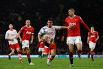 MANCHESTER, ENGLAND - FEBRUARY 19: Matt Tubbs of Crawley Town holds of a challenge from Chris Smalling of Manchester United during the FA Cup sponsored by E.ON 5th round match between Manchester United and Crawley Town at Old Trafford on February 19, 2011 in Manchester, England.  (Photo by Alex Livesey/Getty Images)