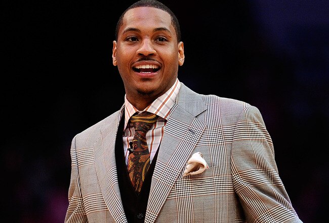 LOS ANGELES, CA - FEBRUARY 18:  Carmelo Anthony of the Denver Nuggets reacts as he takes his seat to watch the T-Mobile Rookie Challenge and Youth Jam at Staples Center on February 18, 2011 in Los Angeles, California.  (Photo by Kevork Djansezian/Getty Images)