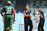 CHENNAI, INDIA - FEBRUARY 20:  Hamish Bennett of New Zealand is congratulated after bowling Collins Obuya of Kenya for LBW during the 2011 ICC World Cup Group A match between Kenya and New Zealand at M. A. Chidambaram Stadium on February 20, 2011 in Chennai, India.  (Photo by Matthew Lewis/Getty Images)