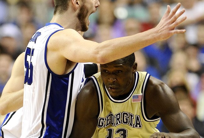 GREENSBORO, NC - MARCH 14:  Brian Zoubek #55 of the Duke Blue Devils guards D'Andre Bell #13 of the Georgia Tech Yellow Jackets in the championship game of the 2010 ACC Men's Basketball Tournament at the Greensboro Coliseum on March 14, 2010 in Greensboro, North Carolina.  (Photo by Jeff Zelevansky/Getty Images)