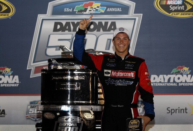 DAYTONA BEACH, FL - FEBRUARY 20:  Trevor Bayne, driver of the #21 Motorcraft/Quick Lane Ford, celebrates with the Harley J. Earl Trophy after winning the NASCAR Sprint Cup Series Daytona 500 at Daytona International Speedway on February 20, 2011 in Daytona Beach, Florida.  (Photo by Matthew Stockman/Getty Images for NASCAR)