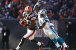 CLEVELAND - NOVEMBER 28:  Wide receiver Brian Robiskie #80 of the Cleveland Browns catches a pass in front of cornerback Captain Munnerlyn #41 of the Carolina Panthers at Cleveland Browns Stadium on November 28, 2010 in Cleveland, Ohio.  (Photo by Matt Sullivan/Getty Images)