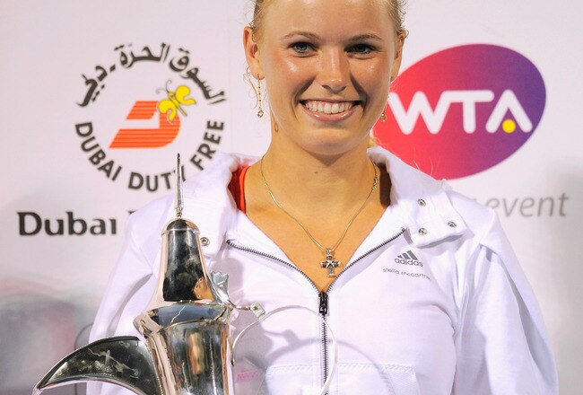 DUBAI, UNITED ARAB EMIRATES - FEBRUARY 20:  Caroline Wozniacki of Denmark poses with the trophy after beating Svetlana Kuznetsova of Russia and winning the final of the Dubai Duty Free Tennis Championship at the Dubai Tennis Stadium on February 20, 2011 in Dubai, United Arab Emirates.  (Photo by Michael Regan/Getty Images)