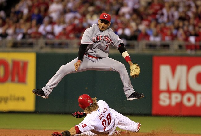 PHILADELPHIA - OCTOBER 08:  Orlando Cabrera #2 of the Cincinnati Reds leaps over Jayson Werth #28 of the Philadelphia Phillies as Werth steals second base during game 2 of the NLDS at Citizens Bank Park on October 8, 2010 in Philadelphia, Pennsylvania. The Phillies defeated the Reds 7-4.  (Photo by Chris Trotman/Getty Images)
