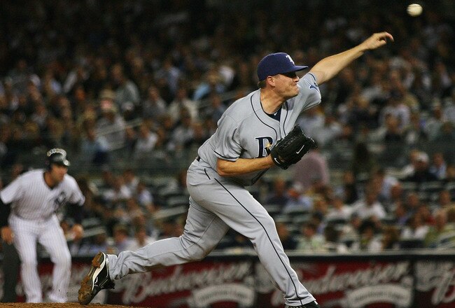 NEW YORK - SEPTEMBER 21:  Jake McGee #57 of the Tampa Bay Rays pitches against the New York Yankees on September 21, 2010 at Yankee Stadium in the Bronx borough of New York City. The Yankees defeated the Rays 8 - 3. (Photo by Andrew Burton/Getty Images)