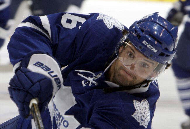 TORONTO - SEPTEMBER 27: Clarke MacArthur #16 of the Toronto Maple Leafs shoots during warmup before a preseason NHL game at the Air Canada Centre against the Buffalo Sabres on September 27, 2010 in Toronto, Ontario, Canada. (Photo by Abelimages/Getty Images)