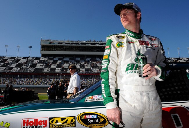 DAYTONA BEACH, FL - FEBRUARY 13:  Dale Earnhardt Jr., driver of the #88 National Guard/AMP Energy Chevrolet, looks on from the grid during qualifying for the NASCAR Sprint Cup Series Daytona 500 at Daytona International Speedway on February 13, 2011 in Daytona Beach, Florida.  (Photo by Jared C. Tilton/Getty Images for NASCAR)
