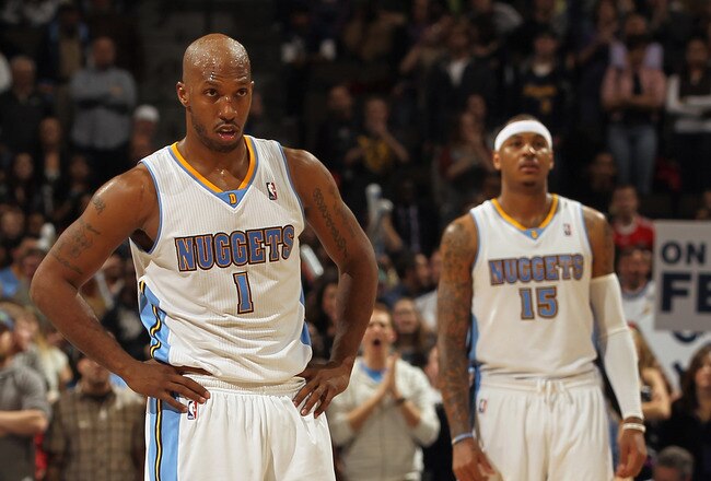 DENVER, CO - FEBRUARY 10:  Arron Afflalo #6, Chauncey Billups #1 and Carmelo Anthony #15 of the Denver Nuggets look on during a break in the action against the Dallas Mavericks during NBA action at the Pepsi Center on February 10, 2011 in Denver, Colorado. The Nuggets defeated the Mavericks 121-120. NOTE TO USER: User expressly acknowledges and agrees that, by downloading and or using this photograph, User is consenting to the terms and conditions of the Getty Images License Agreement.  (Photo by Doug Pensinger/Getty Images)