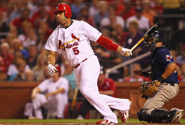 ST. LOUIS - SEPTEMBER 17: Albert Pujols #5 of the St. Louis Cardinals hits an RBI double against the San Diego Padres at Busch Stadium on September 17, 2010 in St. Louis, Missouri.  (Photo by Dilip Vishwanat/Getty Images)