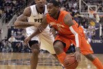 PITTSBURGH, PA - JANUARY 17:  Scoop Jardine #11 of the Syracuse Orange drives to the basket as Gilbert Brown #5 of the Pittsburgh Panthers defends at Petersen Events Center on January 17, 2011 in Pittsburgh, Pennsylvania.  (Photo by Justin K. Aller/Getty Images)