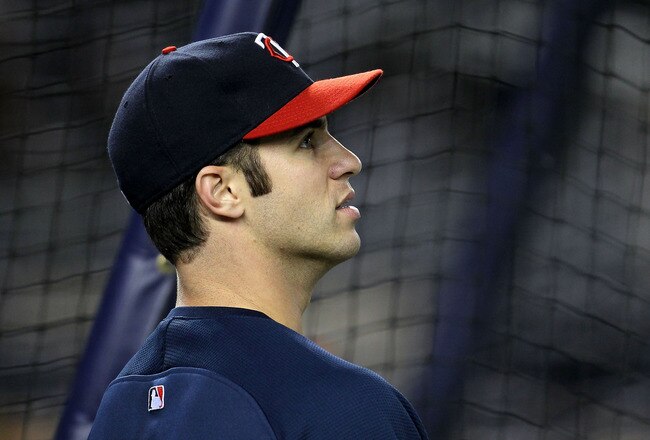 NEW YORK - OCTOBER 09:  Joe Mauer #7 of the Minnesota Twins looks on during batting practice against the New York Yankees during Game Three of the ALDS part of the 2010 MLB Playoffs at Yankee Stadium on October 9, 2010 in the Bronx borough of New York City.  (Photo by Chris McGrath/Getty Images)