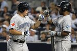 NEW YORK - AUGUST 03:  Travis Snider #45 of the Toronto Blue Jays celebrates hitting a two run home run with teammate Edwin Encarnacion #12 against the New York Yankees at Yankee Stadium on August 3, 2010 in the Bronx borough of New York City.  (Photo by Nick Laham/Getty Images)