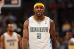 DENVER, CO - JANUARY 13:  Ty Lawson #3 of the Denver Nuggets looks on during a break in the action against the Miami Heat at the Pepsi Center on January 13, 2011 in Denver, Colorado. The Nuggets defeated the Heat 130-102. NOTE TO USER: User expressly acknowledges and agrees that, by downloading and or using this photograph, User is consenting to the terms and conditions of the Getty Images License Agreement.  (Photo by Doug Pensinger/Getty Images)