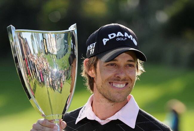 PACIFIC PALISADES, CA - FEBRUARY 20:  Aaron Baddeley of Australia poses with the trophy after the final round of the Northern Trust Open at Riviera Country Club on February 20, 2011 in Pacific Palisades, California.  (Photo by Stuart Franklin/Getty Images)