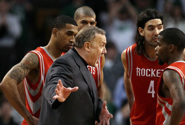 BOSTON, MA - JANUARY 10:  Head coach Rick Adelman of the Houston Rockets talks with Aaron Brooks #0 as Shane Battier #31,Kyle Lowry #7 and Luis Scola #4 stand by during a time out in the final seconds of the game against the Boston Celtics on January 10, 2011 at the TD Garden in Boston, Massachusetts.  The Rockets defeated the Celtics 108-102. NOTE TO USER: User expressly acknowledges and agrees that, by downloading and/or using this Photograph, User is consenting to the terms and conditions of the Getty Images License Agreement.  (Photo by Elsa/Getty Images)