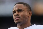 SAN DIEGO - DECEMBER 05:  Nnamdi Asomugha #21 the Oakland Raiders looks on from the sideline against the San Diego Chargers at Qualcomm Stadium on December 5, 2010 in San Diego, California. The Raiders defeated the Chargers 28-13.  (Photo by Jeff Gross/Getty Images)