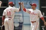 HOUSTON - APRIL 11:  Shane Victorino #8 of the Philadelphia Phillies high fives Jimmy Rollins #11 after defeating the Houston Astros 2-1 at Minute Maid Park on April 11, 2010 in Houston, Texas.  (Photo by Bob Levey/Getty Images)