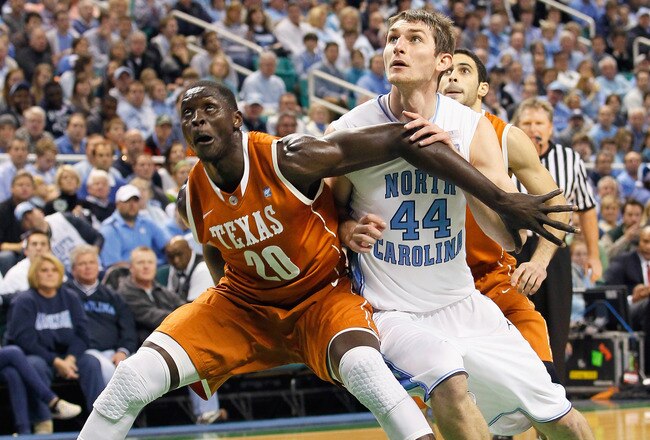 GREENSBORO, NC - DECEMBER 18:  Tyler Zeller #44 of the North Carolina Tar Heels against Alexis Wangmene #20 of the Texas Longhorns at Greensboro Coliseum on December 18, 2010 in Greensboro, North Carolina.  (Photo by Kevin C. Cox/Getty Images)