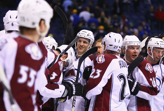 ST. LOUIS, MO - FEBRUARY 22: Jay McClement #16 of the Colorado Avalanche is congratulated by teammates after beating St. Louis Blues at the Scottrade Center on February 22, 2011 in St. Louis, Missouri.  It was McClement's first game back in St. Louis after being traded to the Avalanche from the Blues.  (Photo by Dilip Vishwanat/Getty Images)