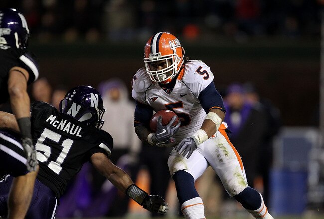 CHICAGO - NOVEMBER 20: Mikel Leshoure #5 of the Illinois Fighting Illini runs past Bryce McNaul #51 of the Northwestern Wildcats on his way to a 339 yard rushing performance during a game played at Wrigley Field on November 20, 2010 in Chicago, Illinois. Illinois defeated Northwestern 48-27. (Photo by Jonathan Daniel/Getty Images)
