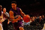 NEW YORK, NY - DECEMBER 20:  Drew Crawford #1 of the Northwestern Wildcats drives against Akeem Bennett #24 of the St. Francis Terriers during the Madison Square Garden Holiday Festival at Madison Square Garden on December 20, 2010 in New York City.  (Photo by Chris Chambers/Getty Images)