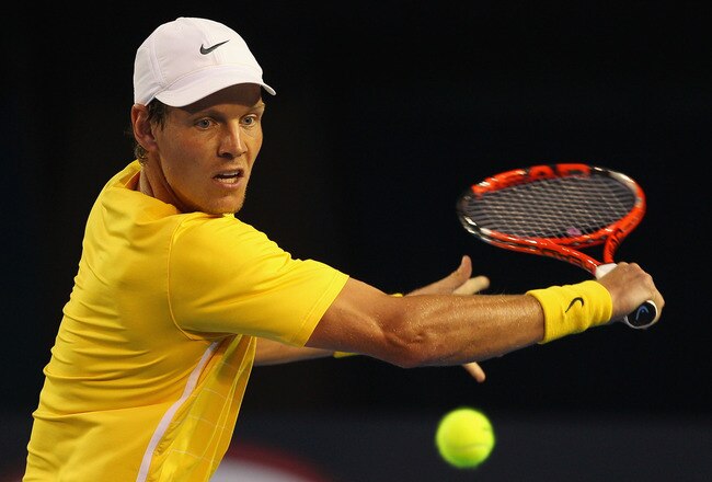 MELBOURNE, AUSTRALIA - JANUARY 25:  Tomas Berdych of the Czech Republic plays a backhand in his quarterfinal match against Novak Djokovic of Serbia during day nine of the 2011 Australian Open at Melbourne Park on January 25, 2011 in Melbourne, Australia.  (Photo by Cameron Spencer/Getty Images)