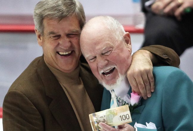 WINDSOR, ON - JANUARY 20:  Head Coach Don Cherry of Team Cherry accepts the $100 win bet from Bobby Orr of Team Orr after the  Home Hardware CHL/NHL Top Prospects game on January 20, 2010 at the WFCU Centre in Windsor, Ontario. Team Cherry defeated Team Orr 4-2. (Photo by Claus Andersen/Getty Images)