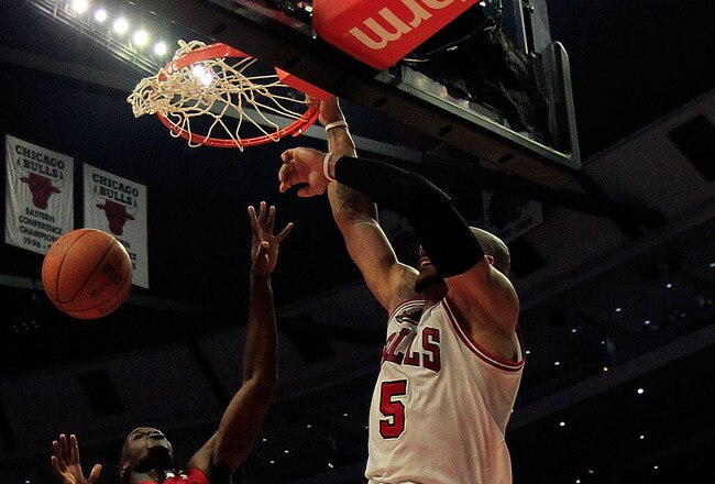 CHICAGO, IL - JANUARY 15: Carlos Boozer #5 of the Chicago Bulls dunks the ball over Joel Anthony #50 of the Miami Heat at the United Center on December 28, 2011 in Chicago, Illinois. The Bulls defeated the Heat 99-96. NOTE TO USER: User expressly acknowledges and agrees that, by downloading and/or using this Photograph, User is consenting to the terms and conditions of the Getty Images License Agreement.  (Photo by Jonathan Daniel/Getty Images)