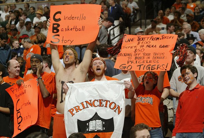 DENVER - MARCH 18:  Fans of the Princeton Tigers cheer during a timeout against the Texas Longhorns during their first round game of the NCAA Division I Men's Basketball Tournament March 18, 2004 at the Pepsi Center in Denver, Colorado.  (Photo by Brian Bahr/Getty Images)