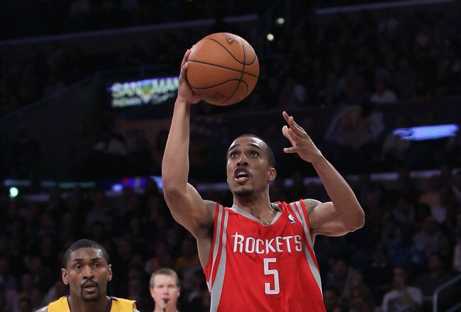 LOS ANGELES, CA - FEBRUARY 01:  Courtney Lee #5 of the Houston Rockets drives past Ron Artest #15 of the Los Angeles Lakers in the second half at Staples Center on February 1, 2011 in Los Angeles, California. The Lakers defeated the Rockets 114-106. NOTE TO USER: User expressly acknowledges and agrees that, by downloading and or using this photograph, User is consenting to the terms and conditions of the Getty Images License Agreement.  (Photo by Jeff Gross/Getty Images)