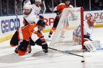 UNIONDALE, NY - DECEMBER 05: Nikolay Zherdev #93 of the Philadelphia Flyers is tripped up by Jack Hillen #38 of the New York Islanders at the Nassau Coliseum on December 5, 2010 in Uniondale, New York.  The Flyers defeated the Islanders 3-2. (Photo by Bruce Bennett/Getty Images)