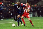 MILAN, ITALY - FEBRUARY 23:  Douglas Maicon of Inter Milan competes with Franck Ribery of FC Bayern Muenchen during the UEFA Champions League round of 16 first leg match between Inter Milan v FC Bayern Muenchen on February 23, 2011 in Milan, Italy.  (Photo by Valerio Pennicino/Getty Images)