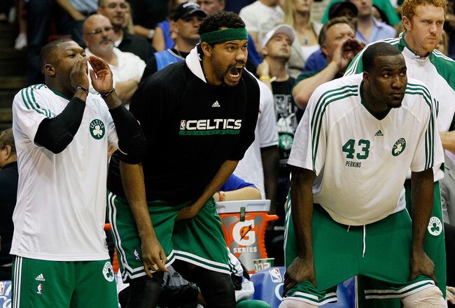 ORLANDO, FL - MAY 18:  (L-R) Nate Robinson #4, Rasheed Wallace #30 and Kendrick Perkins #43 of the Boston Celtics cheer on their teammates from the bench against the Orlando Magic in Game Two of the Eastern Conference Finals during the 2010 NBA Playoffs at Amway Arena on May 18, 2010 in Orlando, Florida.  NOTE TO USER: User expressly acknowledges and agrees that, by downloading and/or using this Photograph, user is consenting to the terms and conditions of the Getty Images License Agreement.  (Photo by Kevin C. Cox/Getty Images)
