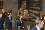 NEW YORK - SEPTEMBER 20:  Former manager of the New York Yankees Joe Torre (3rd L) walks past the monument of late owner George Steinbrenner with his wife Ali prior to the game against the Tampa Bay Rays on September 20, 2010 at Yankee Stadium in the Bronx borough of New York City.  (Photo by Jim McIsaac/Getty Images)