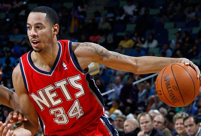 NEW ORLEANS, LA - DECEMBER 22:  Devin Harris #34 of the New Jersey Nets drives the ball around Jarrett Jack #2  of the New Orleans Hornets at the New Orleans Arena on December 22, 2010 in New Orleans, Louisiana.    The Hornets defeated the Nets 105-91.   NOTE TO USER: User expressly acknowledges and agrees that, by downloading and or using this photograph, User is consenting to the terms and conditions of the Getty Images License Agreement.  (Photo by Chris Graythen/Getty Images)