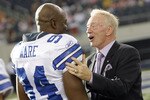 ARLINGTON, TX - AUGUST 21:  Dallas Cowboys team owner Jerry Jones talks with linebacker DeMarcus Ware #94 prior to the Cowboys taking the field against the Tennessee Titans during a preseason game at Cowboys Stadium on August 21, 2009 in Arlington, Texas. (Photo by Tom Pennington/Getty Images)