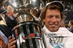NEW ORLEANS - JULY 27:  Jon Bon Jovi co-owner of the Philadelphia Soul celebrates with the trophy at the end of the game during Arena Bowl XXII against the San Jose SaberCats at the New Orleans Arena on July 27, 2008 in New Orleans, Louisiana.  The Philadelphia Soul won 59 to 56.  (Photo by Marc Serota/Getty Images)