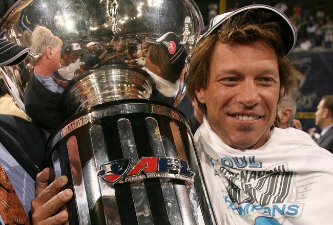 NEW ORLEANS - JULY 27:  Jon Bon Jovi co-owner of the Philadelphia Soul celebrates with the trophy at the end of the game during Arena Bowl XXII against the San Jose SaberCats at the New Orleans Arena on July 27, 2008 in New Orleans, Louisiana.  The Philadelphia Soul won 59 to 56.  (Photo by Marc Serota/Getty Images)
