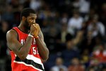 OAKLAND, CA - NOVEMBER 20:  Greg Oden #52 of the Portland Trail Blazers looks on against the Golden State Warriors during an NBA game at Oracle Arena on November 20, 2009 in Oakland, California.  (Photo by Jed Jacobsohn/Getty Images)