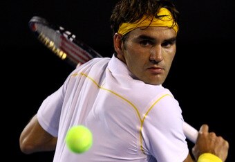 MELBOURNE, AUSTRALIA - JANUARY 27: Roger Federer of Switzerland plays a backhand in his semifinal match against Novak Djokovic of Serbia during day eleven of the 2011 Australian Open at Melbourne Park on January 27, 2011 in Melbourne, Australia. (Photo by Quinn Rooney/Getty Images)