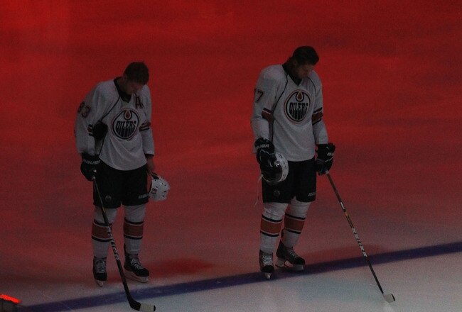 GLENDALE, AZ - NOVEMBER 23:   Ales Hemsky #83 and Dustin Penner #27 of the Edmonton Oilers stand attended for the National Anthem before the NHL game against the Phoenix Coyotes at Jobing.com Arena on November 23, 2010 in Glendale, Arizona.  The Coyotes defeated the Oilers 5-0.  (Photo by Christian Petersen/Getty Images)